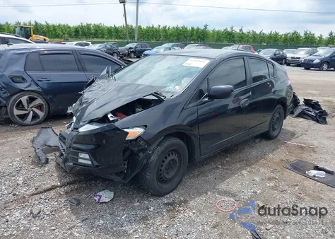 2012 Honda Insight from USA, damaged, VIN JHMZE2H36CS000448